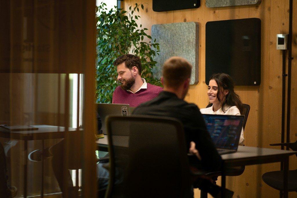 Executive team reviewing AI security audit findings in a meeting